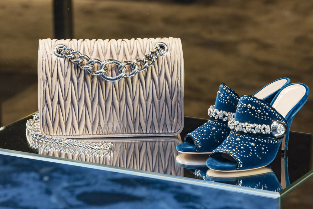 Handbag and a pair of shoes in a luxury boutique