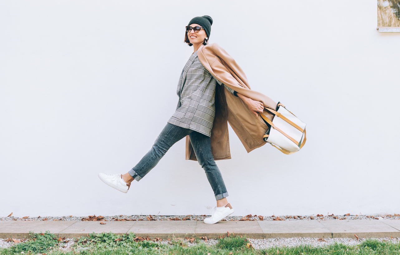 Happy smiling woman walk on the street