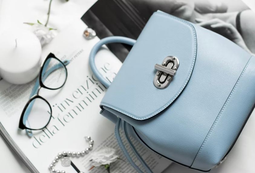 a blue leather purse