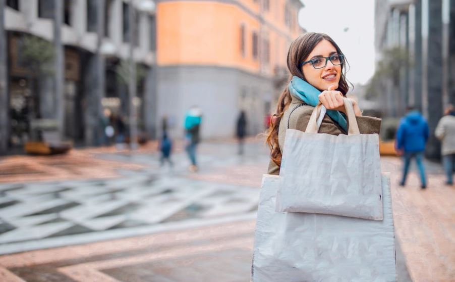 woman carrying tote bags