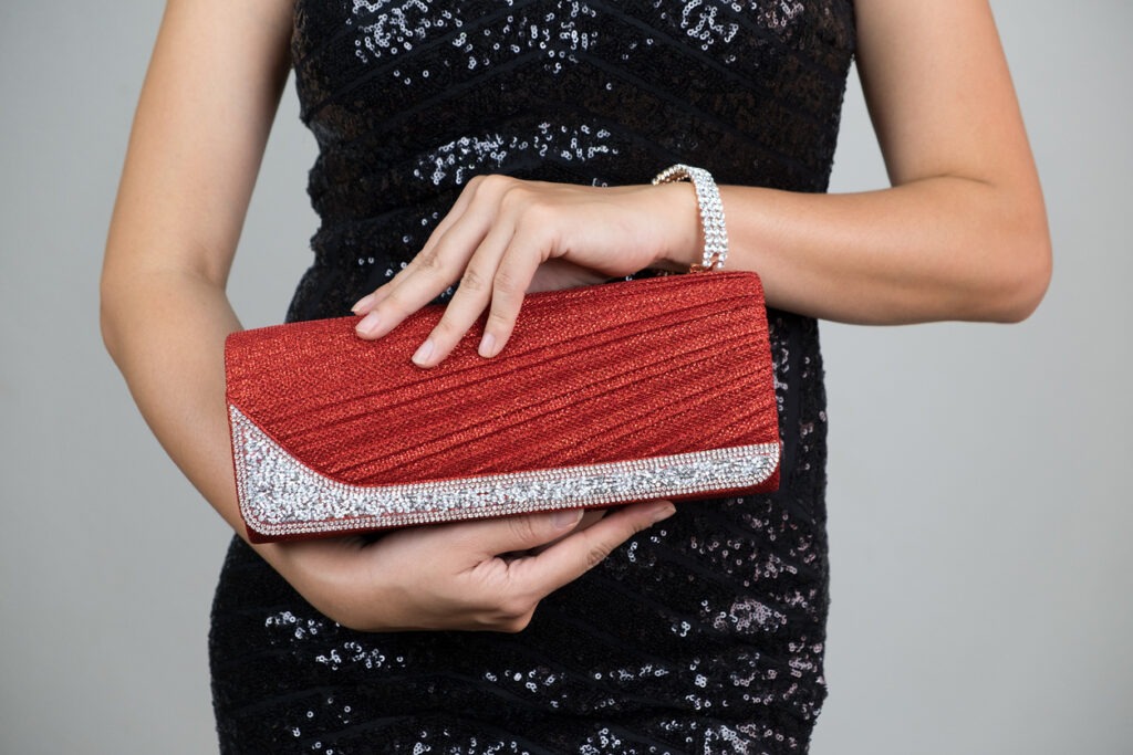 clutch bag photos, purse photos, luxury photos, elegance photos, women photos, fashion model photos, one woman only photos, red photos, beautiful people photos, beauty photos, dress photos, fashion photos, night photos, photography photos
