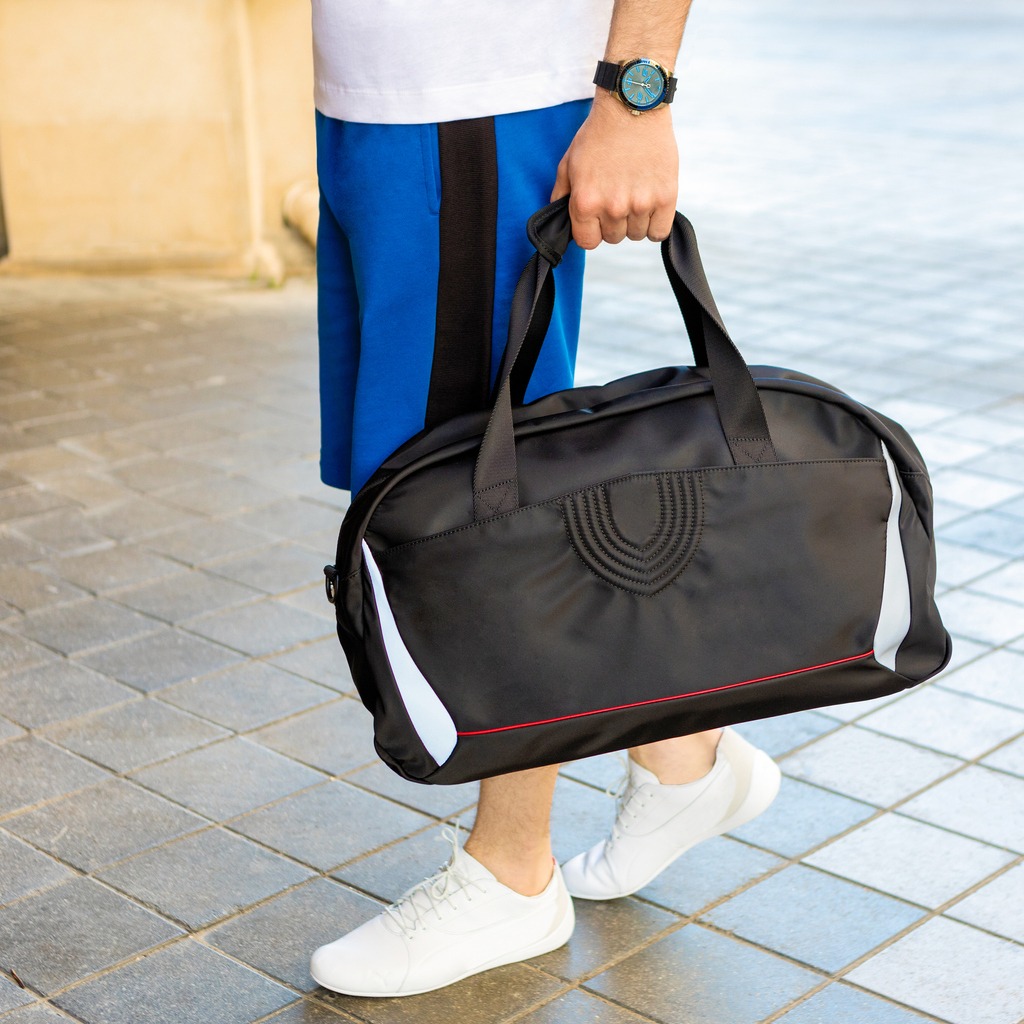 duffle bag photos, packing photos, backpack photos, purse photos, organization photos, bedroom photos, lifestyle photos, luggage photos, preparation photos, young men photos, adult
