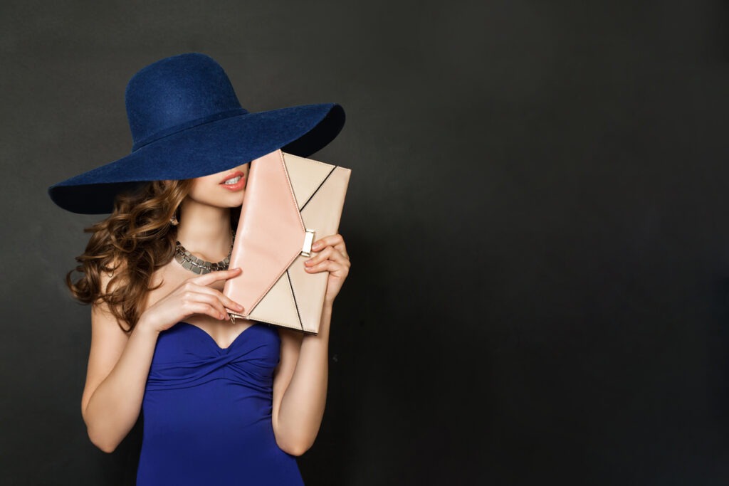 clutch bag, one woman only, women, covering, female, only women, people, adult, art, beautiful people, beautiful woman, beauty, blue, charming, color image