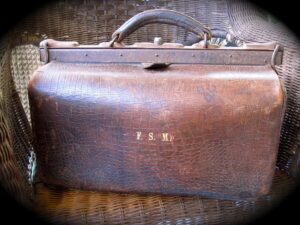 A leather Gladstone bag